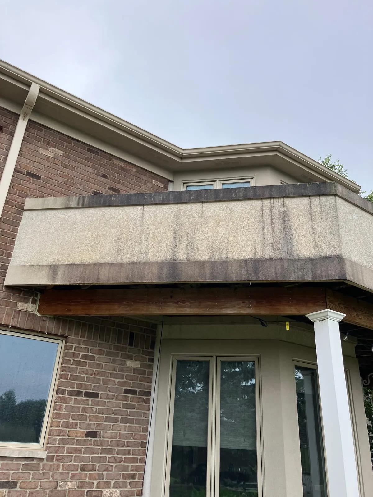 Surface before pressure washing — discolored and stained
